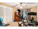 Bedroom featuring a closet, window with curtains, and home gym equipment at 275 Brandon Mill Cir, Fayetteville, GA 30214