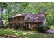 Charming brick two-story home with mature trees and lush landscaping at 275 Brandon Mill Cir, Fayetteville, GA 30214