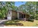 Exterior view of home, featuring attached garage, screened porch, and ample yard space at 275 Brandon Mill Cir, Fayetteville, GA 30214