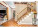 Foyer with hardwood flooring, staircase, and views to other rooms at 275 Brandon Mill Cir, Fayetteville, GA 30214
