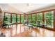 Bright sunroom featuring parquet floors, many windows, and a vaulted ceiling at 275 Brandon Mill Cir, Fayetteville, GA 30214