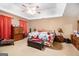 Bedroom featuring a tray ceiling, ceiling fan, and ample space at 275 Brandon Mill Cir, Fayetteville, GA 30214