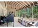 Relaxing screened porch with wood ceiling fan, perfect for enjoying the outdoors at 275 Brandon Mill Cir, Fayetteville, GA 30214