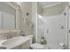 Bathroom with white vanity, marble countertop, and glass-enclosed shower at 240 Longmead Dr, Fayetteville, GA 30215
