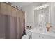 Clean bathroom with a shower and tub, a toilet, a vanity with storage, and neutral decor at 240 Longmead Dr, Fayetteville, GA 30215