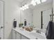 Bright bathroom features a double sink vanity and ample lighting at 240 Longmead Dr, Fayetteville, GA 30215