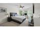 Primary bedroom offering abundant natural light, with many windows, neutral carpet, and a ceiling fan at 240 Longmead Dr, Fayetteville, GA 30215