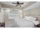Cozy bedroom featuring plush carpet, a window, and neutral wall colors at 240 Longmead Dr, Fayetteville, GA 30215