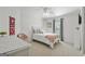 Comfortable bedroom with plush carpet, soft lighting, and a cozy decor with a decorative pink throw at 240 Longmead Dr, Fayetteville, GA 30215