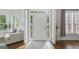 Inviting foyer with hardwood floors, white trim and lots of light at 240 Longmead Dr, Fayetteville, GA 30215