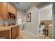 Hallway leading to the bathroom featuring tile floors and plenty of storage at 240 Longmead Dr, Fayetteville, GA 30215