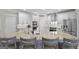 Modern kitchen featuring stainless steel appliances, white cabinets, and a large island with a granite countertop at 240 Longmead Dr, Fayetteville, GA 30215