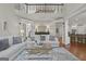 Spacious living room with modern furnishings and a view of the upper level at 240 Longmead Dr, Fayetteville, GA 30215
