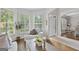 Bright living room with white walls, large windows, and modern furnishings at 240 Longmead Dr, Fayetteville, GA 30215