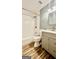 Bathroom featuring a shower-tub combo, wood look flooring, and vanity at 101 Bluegill Trce, Peachtree City, GA 30269