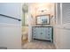 Bright bathroom with a vanity, toilet, and linen closet, adjacent to a carpeted floor at 101 Bluegill Trce, Peachtree City, GA 30269
