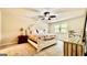 Bright bedroom featuring neutral walls, ceiling fan, carpet and a decorative, off-white bed frame at 101 Bluegill Trce, Peachtree City, GA 30269