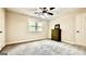 Bright bedroom with carpet flooring, neutral paint, and natural light from the window at 101 Bluegill Trce, Peachtree City, GA 30269