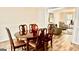 Dining room with a glossy table adjacent to the living room with seating at 101 Bluegill Trce, Peachtree City, GA 30269