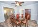 Dining area with wood table and six chairs is adjacent to the living room at 101 Bluegill Trce, Peachtree City, GA 30269