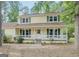 Charming two-story home with a covered front porch and lovely green shutters at 101 Bluegill Trce, Peachtree City, GA 30269