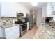 Updated kitchen offers granite countertops and stainless steel appliances throughout at 101 Bluegill Trce, Peachtree City, GA 30269