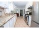Modern kitchen boasts stainless appliances, granite countertops, and ample storage at 101 Bluegill Trce, Peachtree City, GA 30269