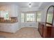 Kitchen with breakfast nook, tan tile floors, and white moulding at 101 Bluegill Trce, Peachtree City, GA 30269