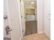Convenient laundry room features washer, dryer, and storage cabinets off kitchen at 101 Bluegill Trce, Peachtree City, GA 30269