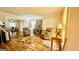 Inviting living room features wood floors, cozy seating, and views into the dining area at 101 Bluegill Trce, Peachtree City, GA 30269
