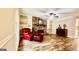 Living room featuring a fireplace, built-in shelves and a single red chair at 101 Bluegill Trce, Peachtree City, GA 30269