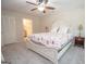 Comfortable bedroom featuring a large bed and carpeted floors at 101 Bluegill Trce, Peachtree City, GA 30269