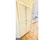 Large pantry with white cabinets and tile floor offering plenty of storage at 101 Bluegill Trce, Peachtree City, GA 30269