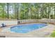 Refreshing in-ground pool in a private, tree-lined backyard; great for summer fun and relaxation at 101 Bluegill Trce, Peachtree City, GA 30269