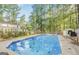 Large in-ground pool with a full wooded surround at 101 Bluegill Trce, Peachtree City, GA 30269