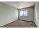 Carpeted bedroom with closet and natural light from the window at 313 Country Club Dr, Jonesboro, GA 30238