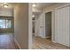 Spacious, neutral hallway featuring a glimpse of the living room and bedrooms at 313 Country Club Dr, Jonesboro, GA 30238