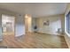 Open living room and dining room area with hardwood flooring and neutral wall colors at 313 Country Club Dr, Jonesboro, GA 30238