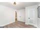 Bright bedroom with hardwood floors, white walls, closet and ensuite bathroom access at 1091 Pine St, Conyers, GA 30012