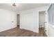 Bright bedroom with hardwood floors, white walls, closet and ensuite bathroom access at 1091 Pine St, Conyers, GA 30012