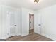 Bright bedroom featuring luxury vinyl flooring, neutral colors, and two closets at 1091 Pine St, Conyers, GA 30012