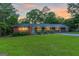 Charming home with a brick facade, manicured landscaping, and inviting covered porch at 1091 Pine St, Conyers, GA 30012