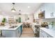 Open kitchen featuring stainless steel appliances, quartz countertops, a kitchen island, and an eat-in kitchen at 1091 Pine St, Conyers, GA 30012