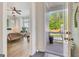 View from the doorway of a staged bedroom with hardwood floors, ceiling fan and an attached porch at 405 Bandon Way, Peachtree City, GA 30269