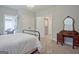 Bedroom features carpet, chandelier and doors leading to the closet and outdoor porch at 405 Bandon Way, Peachtree City, GA 30269