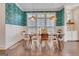 Charming dining room with modern pendant lights, stylish wallpaper, and ample seating at 405 Bandon Way, Peachtree City, GA 30269