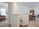 Bright upper level landing with adjacent rooms featuring neutral walls, carpet and natural light at 405 Bandon Way, Peachtree City, GA 30269