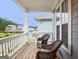 Outdoor porch with two rocking chairs and a lovely neighborhood view at 405 Bandon Way, Peachtree City, GA 30269