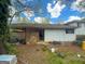 Exterior back of house featuring white siding and a covered carport at 5637 Sturbridge Way, South Fulton, GA 30349