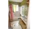 Bathroom with a tub and vanity, ideal for a complete renovation project at 5637 Sturbridge Way, South Fulton, GA 30349